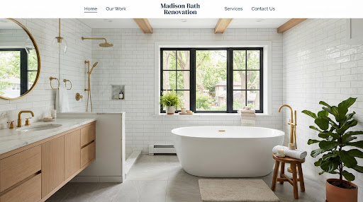 Traditional bathroom design inspiration with a soaking tub, light tile, brass fixtures, and natural light